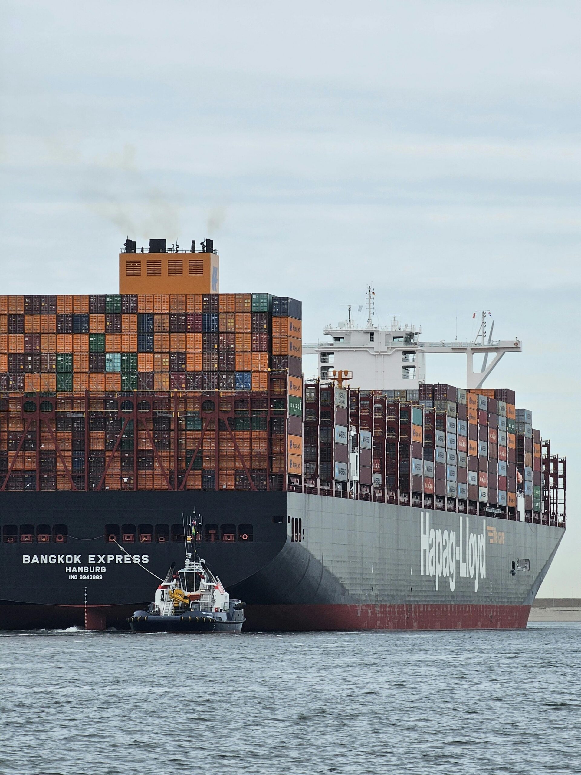 A large container ship at Maasvlakte Rotterdam, showcasing global shipping.
